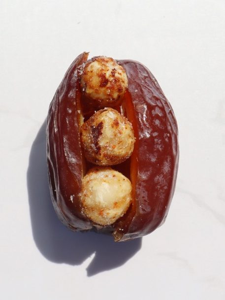 plump medjool date filled with our signature pate de fruits in a strawberry and peach flavour - a sweet sensation!