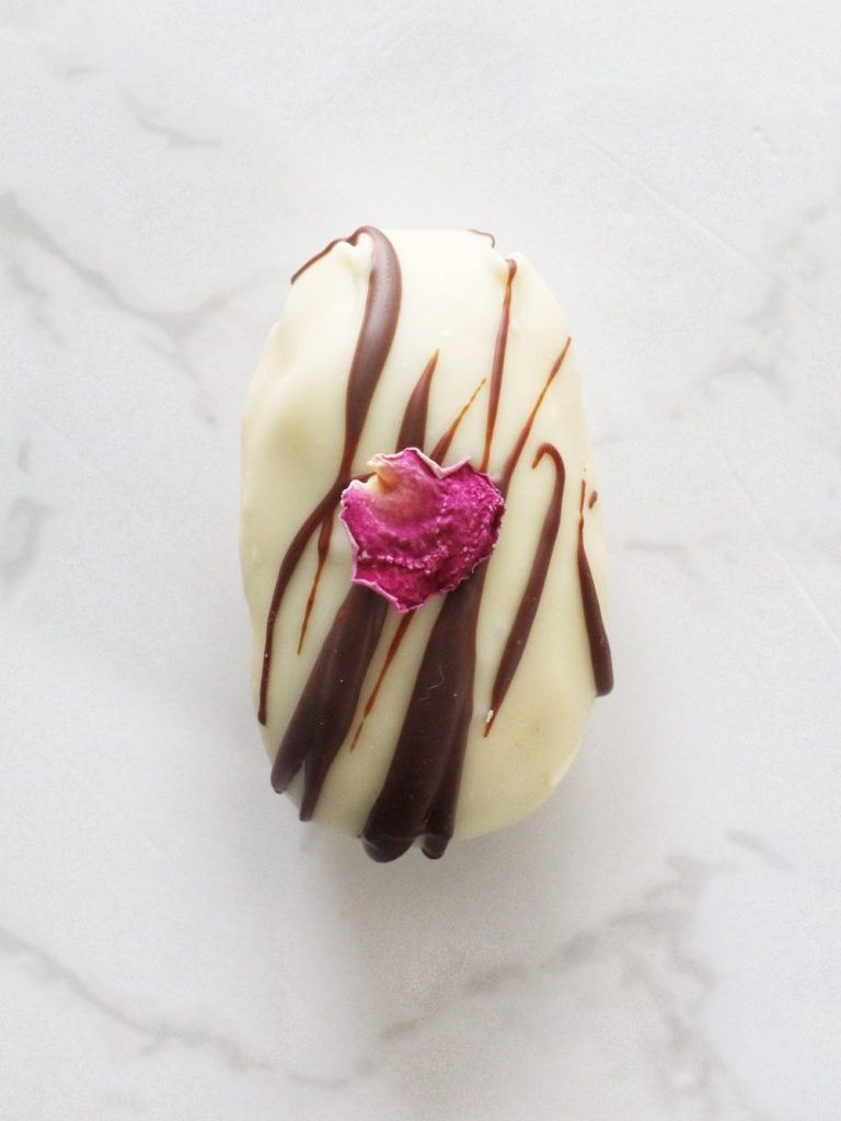 chocolate coated date infused with a rose date pulp and topped with a single rose petal