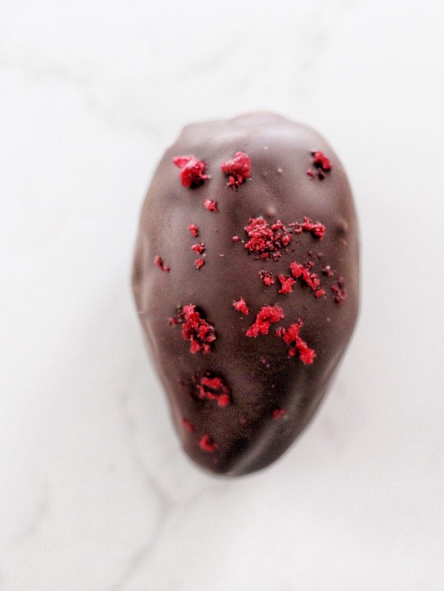 plump medjool date filled with our signature pate de fruits in a strawberry and peach flavour - a sweet sensation!